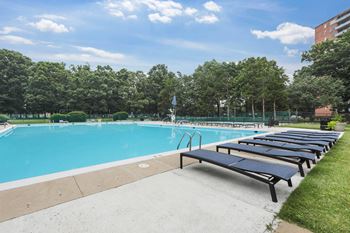 Outdoor swimming pool with sun lounger
